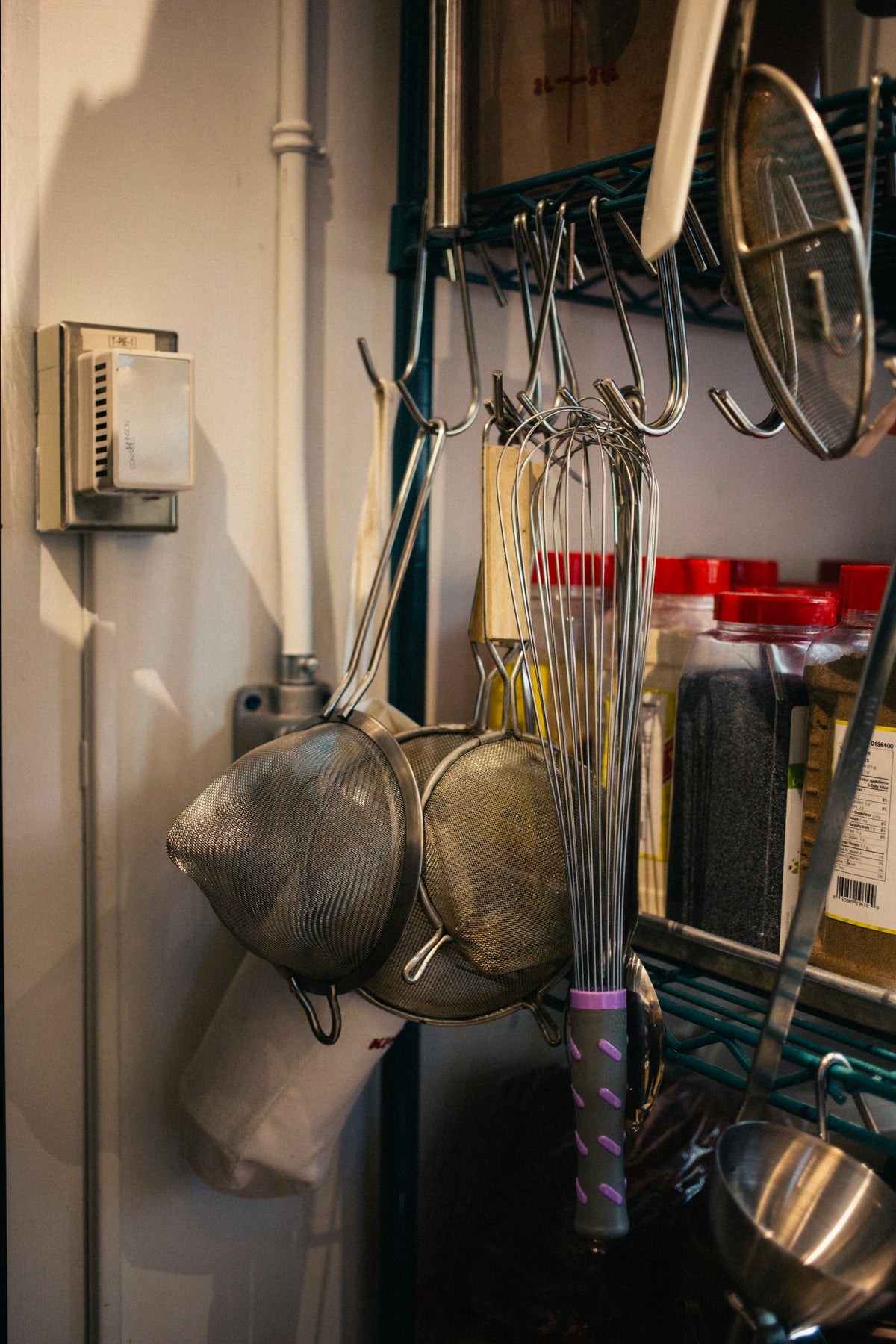 Kitchen utensils hanging on hooks